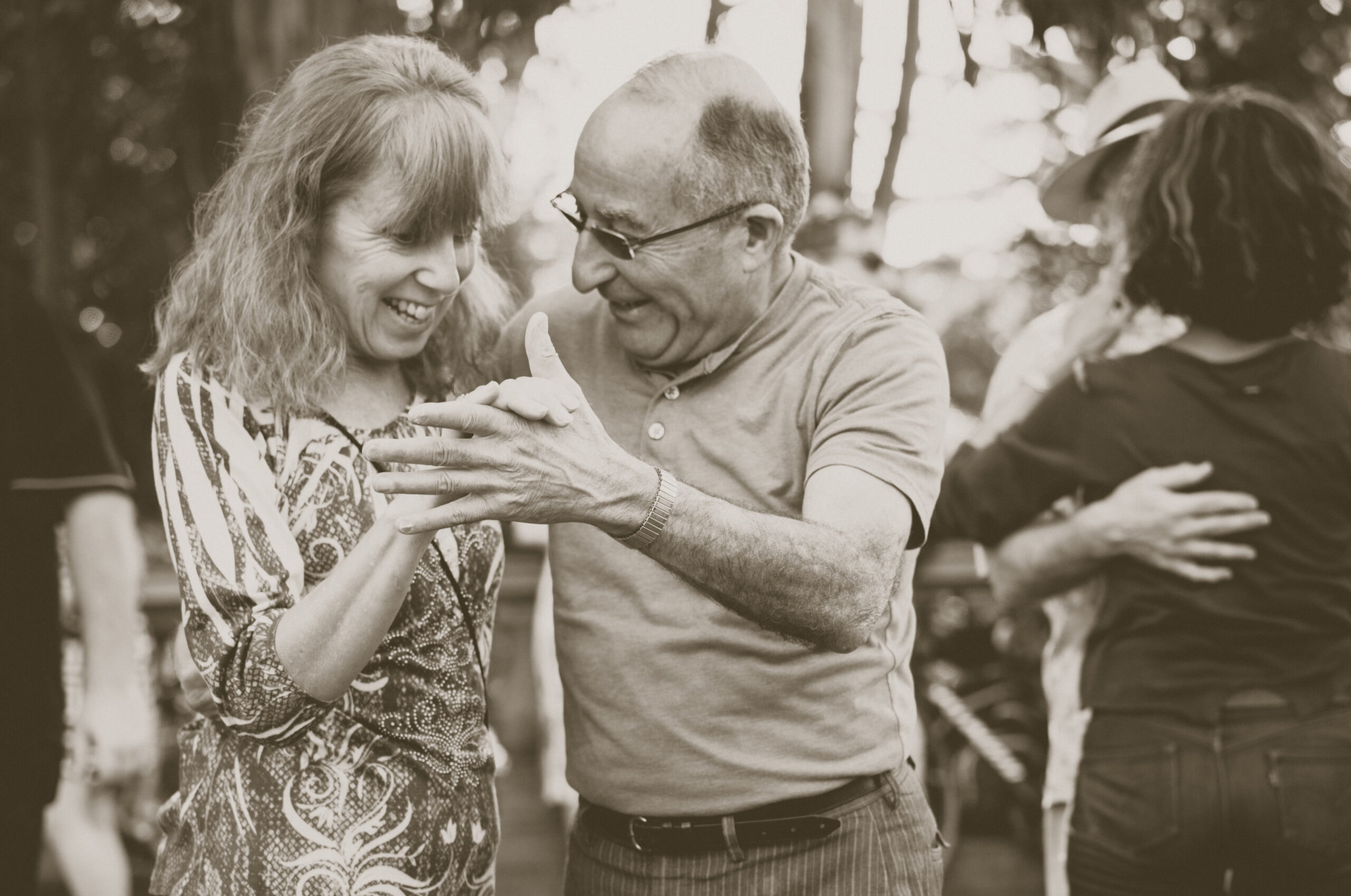 Adult daughter dancing with elderly. Elderly support in America.